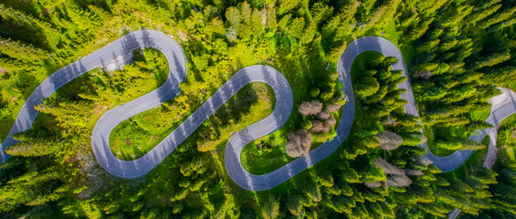 Snake Road in the Dolomites. Sunrise aerial forest