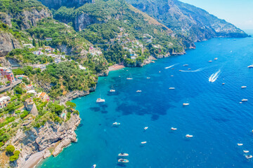 Obraz premium Positano town, beach and beautiful colorful houses on the cliff in Amalfi coast in Italy