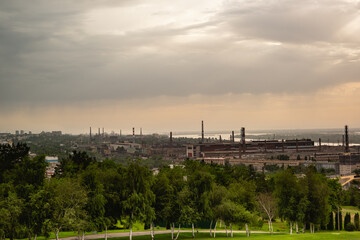 View from Mamaev Kurgan to the industrial part of the city on the banks of the Volga River Cloudy morning