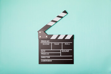 Movie clapper. Movie clapperboard on a bright colored background. Concept of rest and...