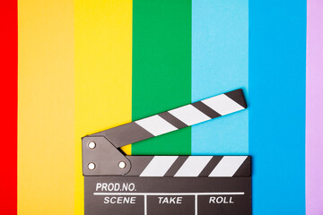 Movie clapper. Movie clapperboard on a bright colored background. Concept of rest and...