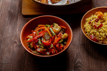 Tzimmes with vegetables on the festive table for the meal on Rosh Hashanah