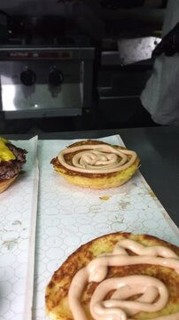 chef preparing hambuger to go