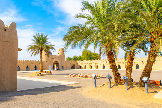 Palm trees inside defensive walls and courtyard of the historic Al Jahili Fort, in Al Ain, Abu Dhabi, the United Arab Emirates.	