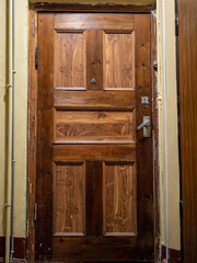 wooden door illuminated by electric light