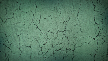 Green cracked earth texture in 4K resolution, ideal for natural backgrounds, eco-themed designs, and environmental projects with a realistic touch