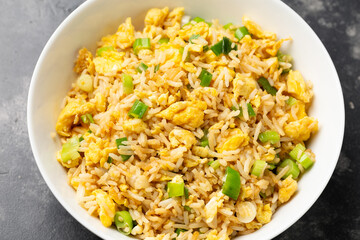 Egg fried rice with garlic, ginger, spring onion and soy sauce. Asian food