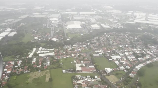 View from an airplane descending over central Costa Rica on approach to San Jose International Airport.