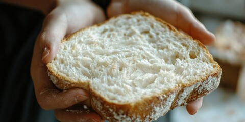Hand Holding Sliced Loaf of Bread