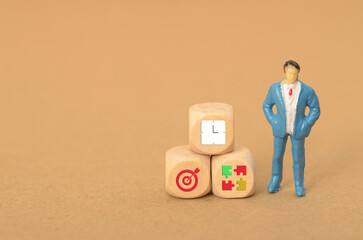 Business people with clocks, targets, and puzzles often juggle multiple priorities and deadlines,...