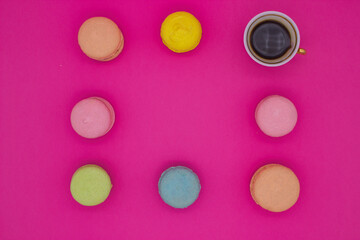 Colorful Macaron with Coffee on a Bright Pink Background
