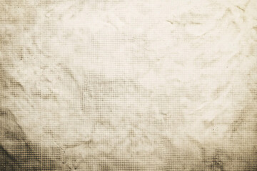 Obraz premium A vintage paper texture with a faded grid pattern and worn areas creating an antique look ideal for background designs and overlays
