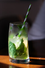 A glass of lemonade with mint