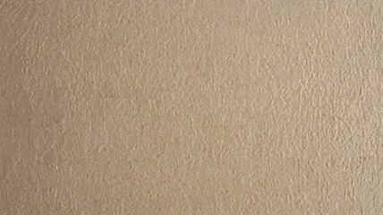 An inviting minimalist backdrop highlights a gently textured beige surface, perfect for enhancing various creative projects, presentations, or artistic displays