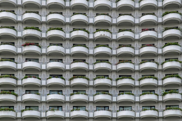 Obraz premium Close-up of contemporary glass building facades with reflections, showcasing modern urban architecture and geometric design in Dubai city, UAE. Abstract architecture background