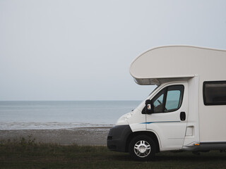 Nasturtium coach built motor home parked by the sea