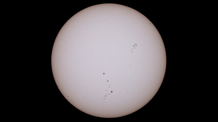 photograph of the sun made with a reflex camera, sunspots are observed