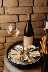 Elegant oysters on ice with lemon and white wine, perfect for gourmet dining and special occasions