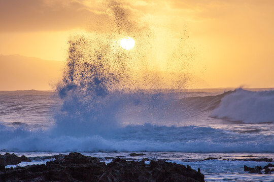 USA, Hawaii, Oahu, North Shore and waves crashing ashore right at sunset