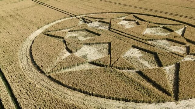 Mysterious Marten crop circle formation aerial view circling over Wiltshire agricultural wheat field