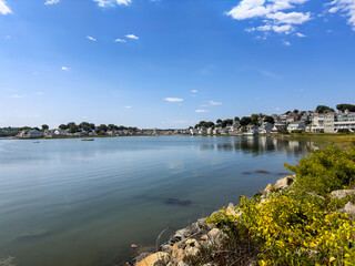 Fototapeta premium Homes pack the edges of the bay in Hull, Massachusetts, by Nantasket Beach