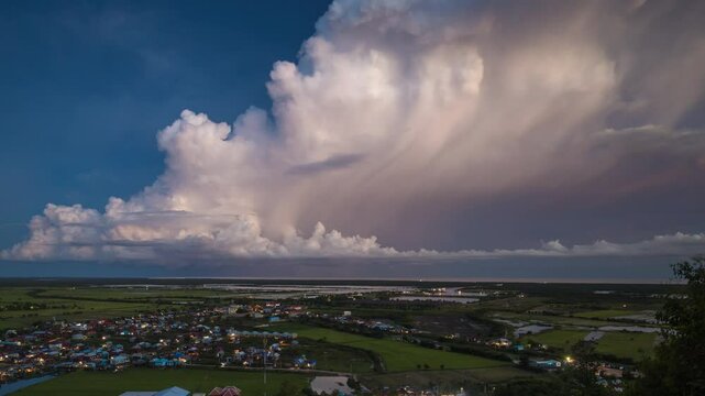 Cumulonimbus formations chuffing storm popping lightning strikes , over the Tonle Sap Lake, Cambodia.