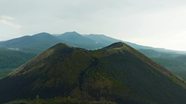 DRONE: REVEAL DOLLY IN SHOT OF PARICUTIN VOLCANO IN MICHOACAN ON A CLOUDY DAY