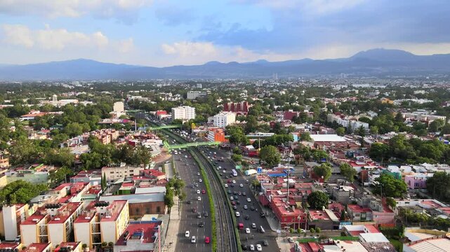 Afternoon traffic in Mexico City with a view to the south and the Ajusco Mountain