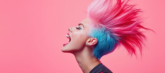 A woman expresses her individuality with a striking pink and blue mohawk, her mouth open in a passionate shout, all framed by a vivid pink backdrop creating a bold visual statement.