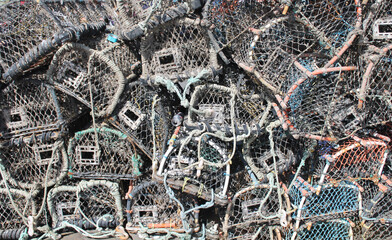 Lobster pots stacked  on the harbour side in Whitby North Yorkshire in the UK 