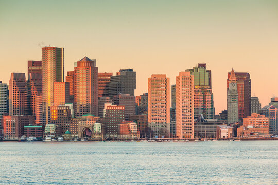 USA, Massachusetts, Boston. City skyline from Boston Harbor at dawn.