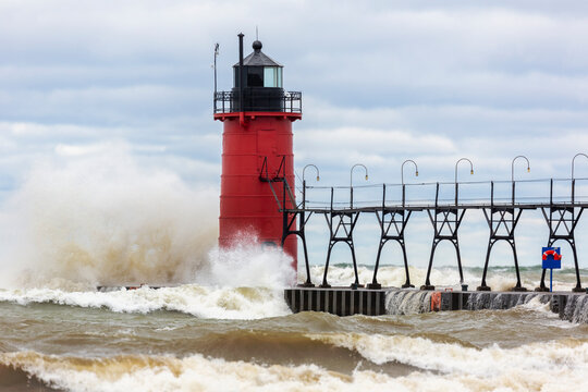South Haven Lighthouse with high waves crashing, South Haven, Michigan.