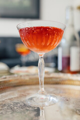 sparkling rose wine in coupe glass for afternoon happy hour