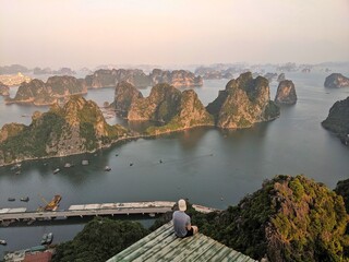 Panoramic view of Ha Long Bay, Vietnam, with its iconic limestone islands rising from the emerald waters