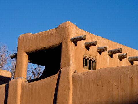 USA, New Mexico, Sante Fe. Southwest architecture, part of a earth colored adobe house in Santa Fe.