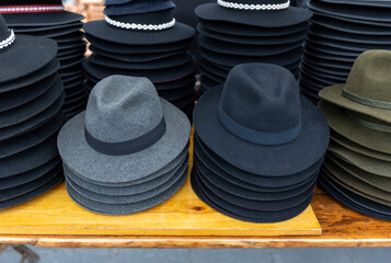 Various hat in assortment pile