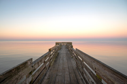 USA, Texas. Pier on Trinity Bay, calm sunrise