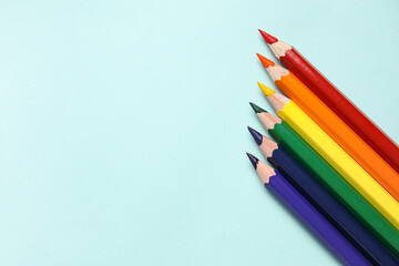 Obraz premium Colorful pencils on blue background. LGBT concept
