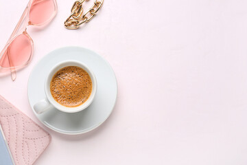 Cup of hot espresso and accessories on white background