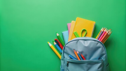 Backpack with school stationery on green background, top view , Back to school, flat lay, school supplies, education, learning