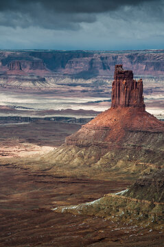 USA, Utah. Rock formations from the Green River Overlook with canyons with thunderclouds in Canyonlands National Park