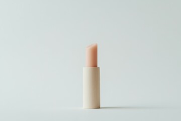 a natural lip balm in stick form. The lip balm should have a light pink tint and be housed in minimalistic, Paper Eco-Tube. Display the lip balm on a clean white background