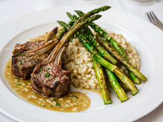 The perfect blend of soft asparagus, lamb chops and risotto generative ai