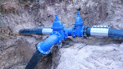 Gate valve and splitter. Underground main water supply system repaired and maintained and assembled...
