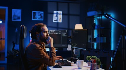 Software engineer doing programming using augmented reality visualization during remote job shift...