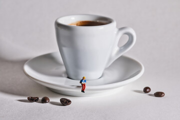 A woman reads a book with a cup of coffee