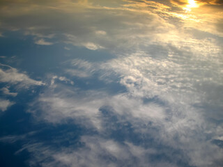 Fototapeta premium clouds at sunset with yellow sun