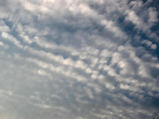 white gray clouds against blue sky