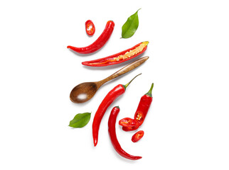 Fresh chili pepper and spoon on white background. Top view