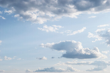 gentle white clouds in the blue sky